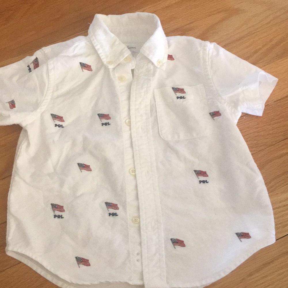 White button down polo shirt with 🇺🇸 flags.